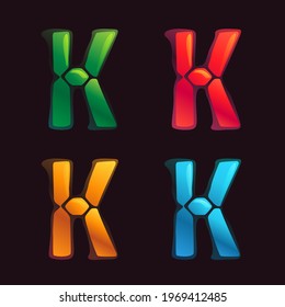 K letter logo in alarm clock style. Digital font in four color schemes for futuristic company identity, nightlife magazine, expressive posters.