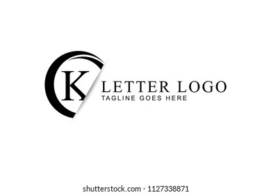 K letter logo design with circle and paper cut in black color.