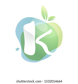 K letter logo with negative space at green watercolor splash background. Vector elements for organic food labels, ecology presentation, card etc.