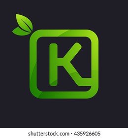 K letter logo in square and green leaves. 