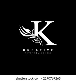 K letter logo vector design with leaf decoration. monogram K, typography. feather logo. luxury K. K flourish. suitable for logo of business, company, product, boutique, wedding, hotel, etc