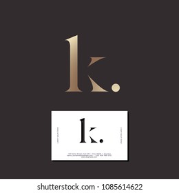 K letter. K monogram. Elegant gold monogram K with dot on a dark background. Original business card.