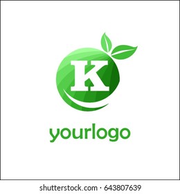 K letter organic market logo. Eco green food brand identity. Fresh apple with letters in a circle with leaves.