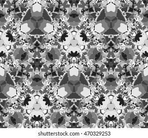 Kaleidoscope seamless pattern. Composed of abstract elements located on a white background. Useful as design element for texture and artistic compositions. Vector illustration.