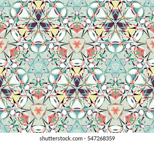 Kaleidoscope seamless pattern. Composed of color abstract shapes. Useful as design element for texture and artistic compositions.
