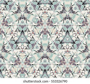 Kaleidoscope seamless pattern. Composed of color abstract shapes. Useful as design element for texture and artistic composition.