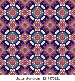Kaleidoscopic seamless pattern in blue, pink and violet colors. It can be used in the design of textiles, in the printing industry. Vector illustration.