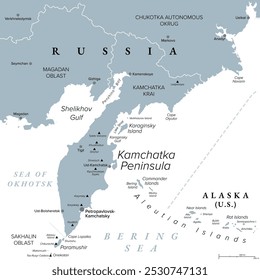 Kamchatka Peninsula and federal subject Kamchatka Krai of Russia, gray political map. Peninsula with numerous volcanoes between Bering Sea and Sea of Okhotsk. Offshore runs the Kuril-Kamchatka Trench.