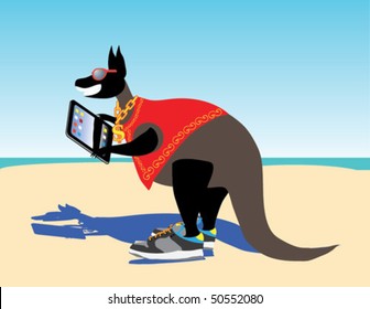 Kangaroo on the beach playing with the computer - Shutterstock ID 50552080