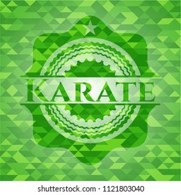 Karate green emblem with triangle mosaic background