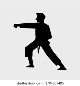 Karate man showing punch technique icon. Sport vector silhouette illustration