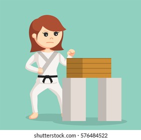 karate woman doing breaking boards technique