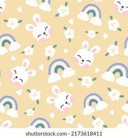 Kawaii white hare face on a pastel yellow background with clouds, flowers and rainbows. Kids woodland animals seamless pattern motif for wrapping paper, fabric and textile print