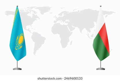 Kazakhstan and Madagascar flags for official meeting against background of world map.