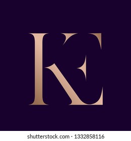 KE monogram.Typographic logo with uppercase letter k and letter e.Serif lettering icon in rose gold metallic color isolated on dark background.Modern, elegant wedding, beauty and style sign.