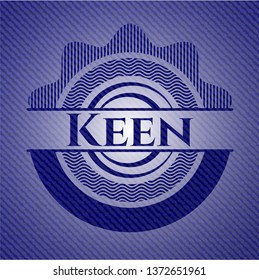 Keen emblem with jean background