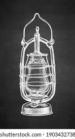 Kerosene lamp. Vintage oil lantern. Chalk sketch on blackboard background. Hand drawn vector illustration. Retro style.