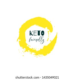 Keto friendly. Lettering on hand paint yellow watercolor texture isolated on white background. Ink dry brush stains, stroke, splash, smudge, scribble. Low carb high fat motivation quote menu poster.