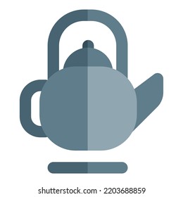 Kettle containing tea placed on stove.