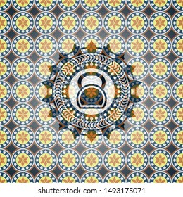 kettlebell icon inside arabic style badge. Arabesque decoration.