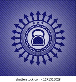 kettlebell icon inside badge with denim background