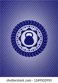 kettlebell icon inside badge with denim texture