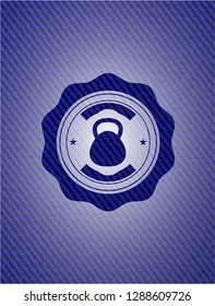 kettlebell icon inside badge with denim texture