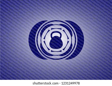 kettlebell icon inside badge with jean texture