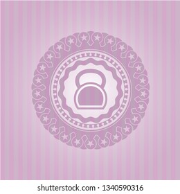 kettlebell icon inside badge with pink background