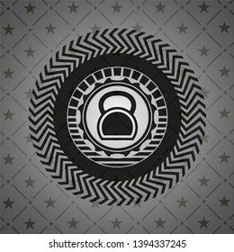 kettlebell icon inside black badge