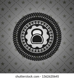 kettlebell icon inside black emblem