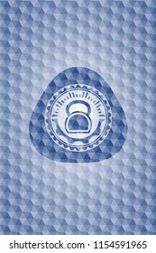kettlebell icon inside blue emblem or badge with abstract geometric pattern background.