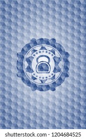kettlebell icon inside blue emblem or badge with abstract geometric pattern background.