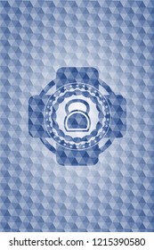 kettlebell icon inside blue emblem or badge with abstract geometric polygonal pattern background.