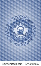 kettlebell icon inside blue emblem or badge with abstract geometric polygonal pattern background.