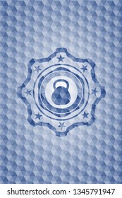 kettlebell icon inside blue emblem or badge with geometric pattern background.