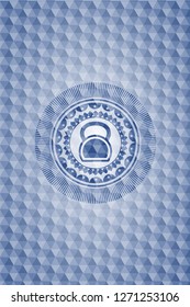 kettlebell icon inside blue polygonal emblem.