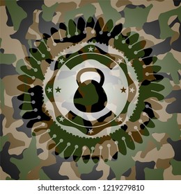 kettlebell icon inside camouflaged emblem