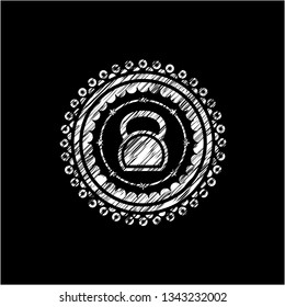 kettlebell icon inside chalkboard emblem written on a blackboard