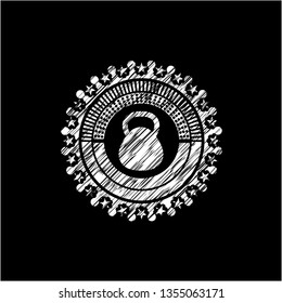 kettlebell icon inside chalkboard emblem on black board