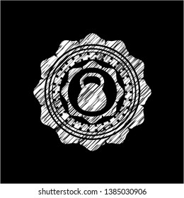 kettlebell icon inside chalkboard emblem on black board