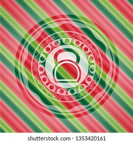 kettlebell icon inside christmas emblem.