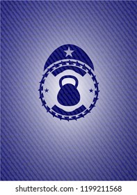 kettlebell icon inside emblem with denim high quality background