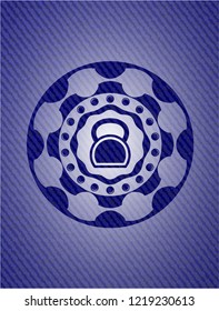 kettlebell icon inside emblem with denim texture