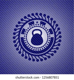 kettlebell icon inside emblem with denim texture