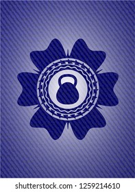 kettlebell icon inside emblem with denim high quality background