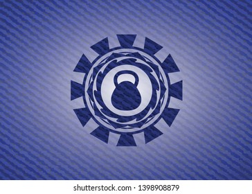 kettlebell icon inside emblem with denim high quality background