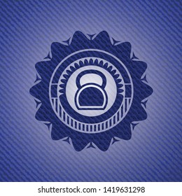 kettlebell icon inside emblem with denim high quality background
