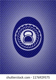 kettlebell icon inside emblem with jean background