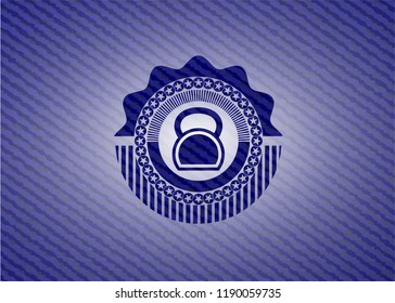 kettlebell icon inside emblem with jean background